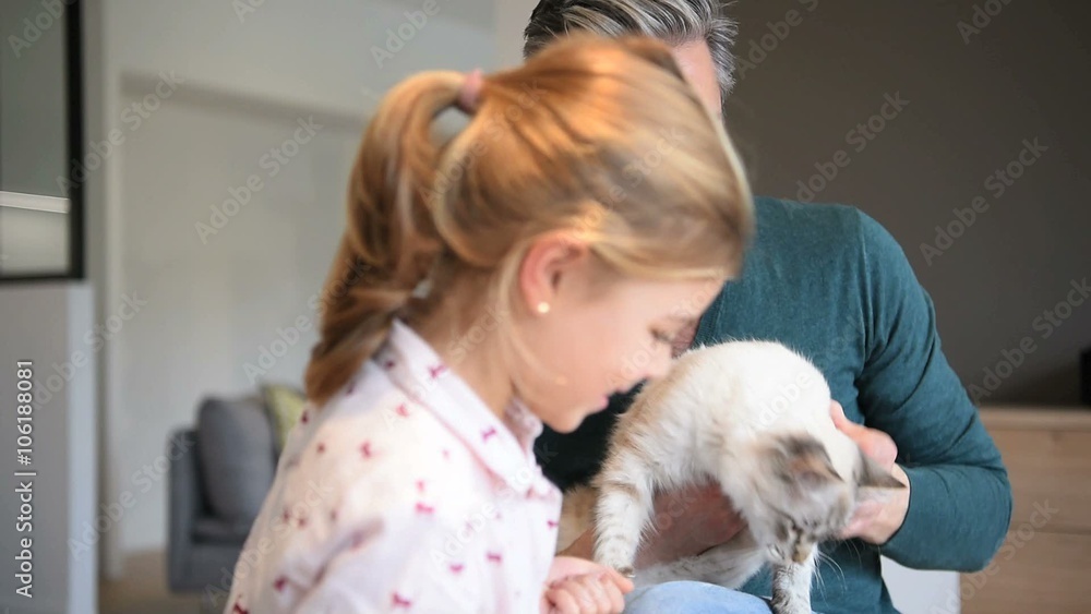 Daddy with little girl cuddling with cat Daddy with little girl cuddling with cat