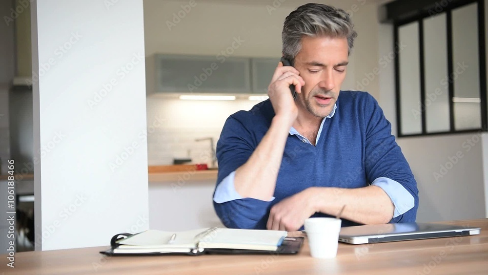Man working from home-office with laptop computer Man working from home-office with laptop computer