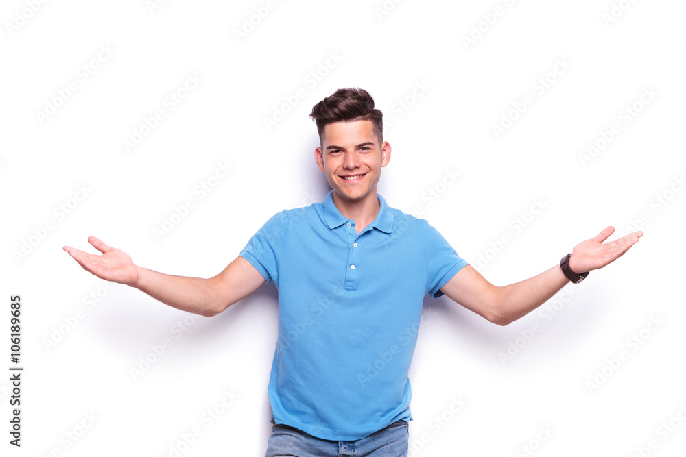 young man in jeans and blue polo shirt welcoming young man in jeans and blue polo shirt welcoming