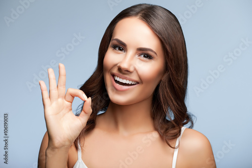 Woman showing okay or zero hand gesture