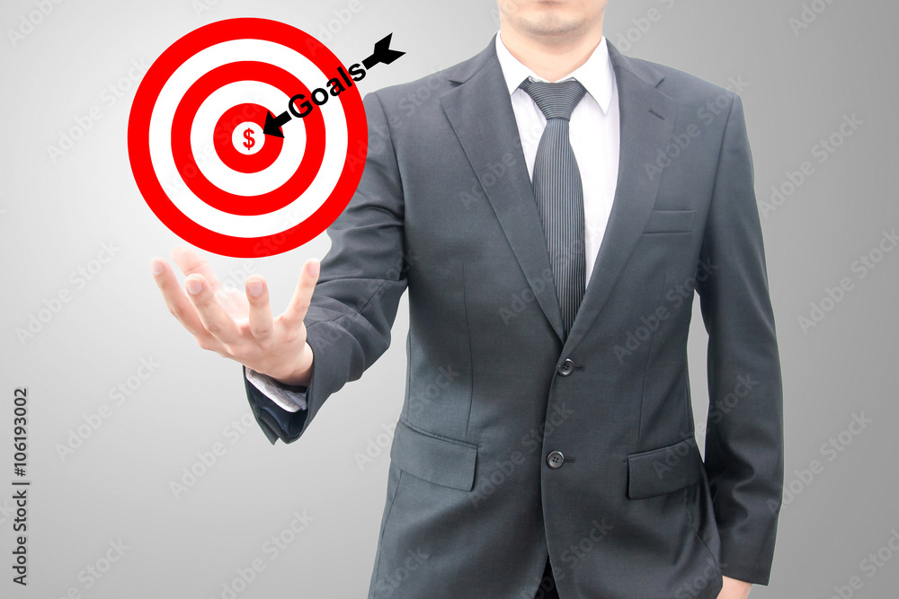 Businessman hold goals to the target business concept Businessman hold goals to the target business concept