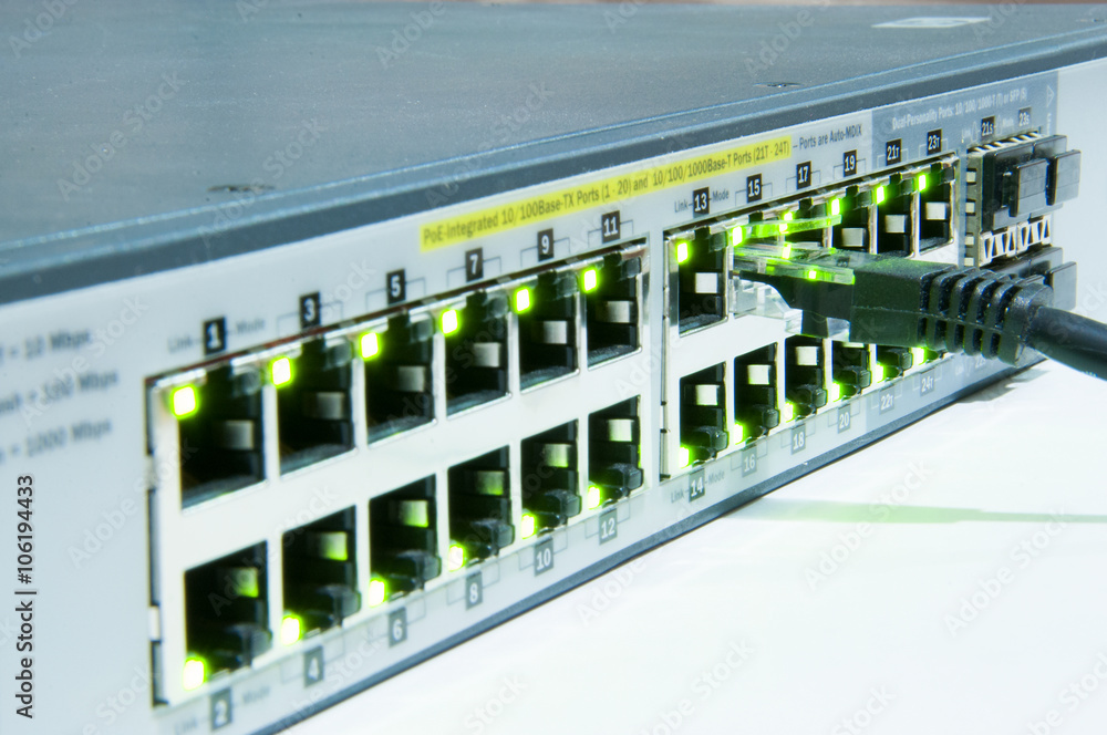 Ethernet network switch with UTP cable isolated on the white Ethernet network switch with UTP cable isolated on the white