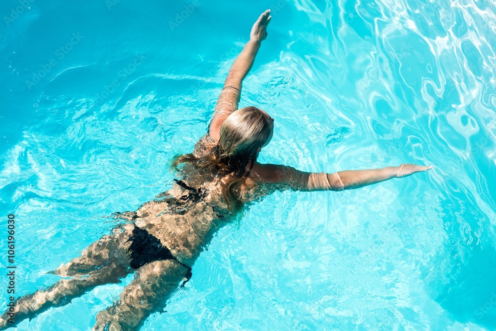Fit woman swimming in the pool