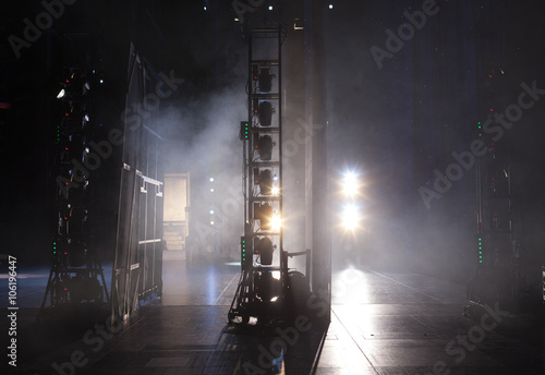 Light from the scene during the concert.
light in the theater, a concert, a circus 