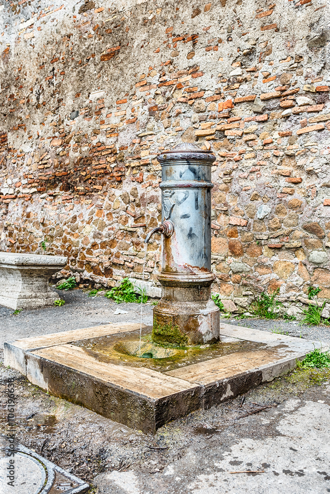 Traditional free water public fountain in Rome, Italy Traditional free water public fountain in Rome, Italy