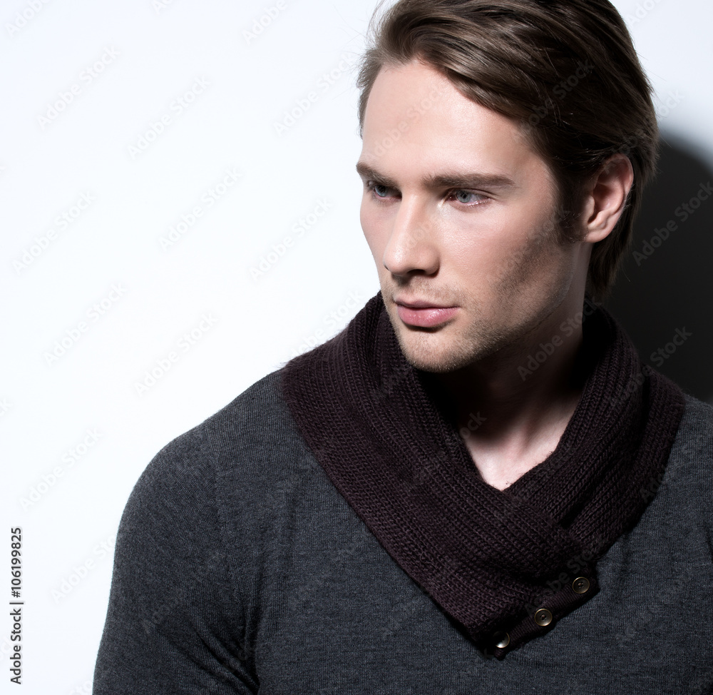 Fototapeta premium Handsome sexy man in gray pullover.