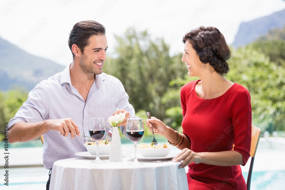 Happy couple having food 