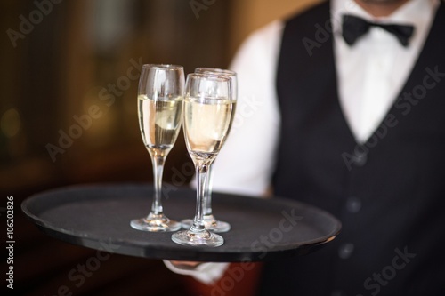 Waiter with tray of champagne 