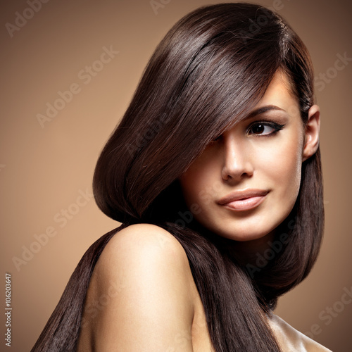 Beautiful young woman with long straight brown hair.