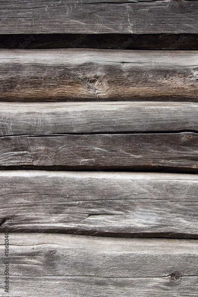 Country house wall from old wooden logs. Natural wooden backgrou Country house wall from old wooden logs. Natural wooden backgrou