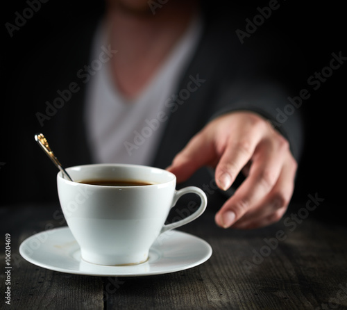 Obraz na płótnie Reaching for a Coffee Cup w salonie