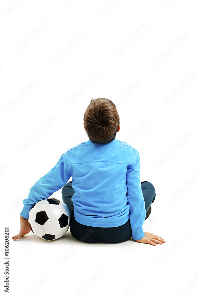 Back view of a child in sportswear with soccer ball. Isolated on white background. Soccer ball 