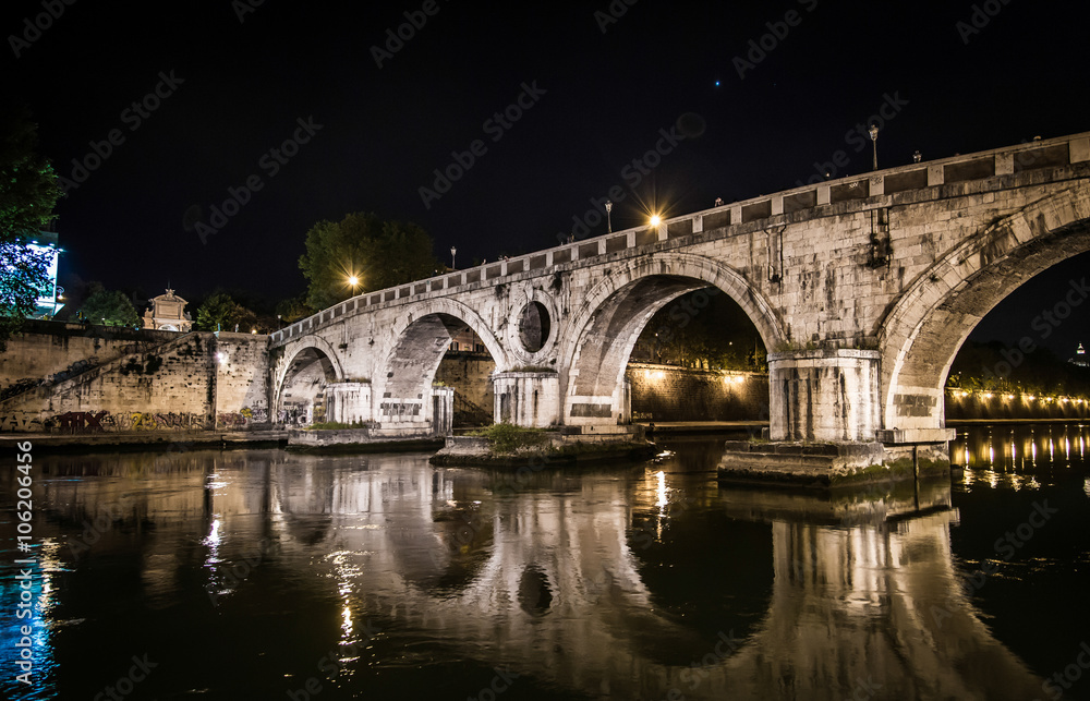 Beautiful bridge over the Tiber at night in Rome