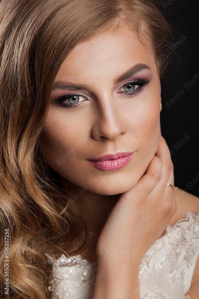 Beauty model girl with perfect make-up isolated over black. Portrait of attractive young woman with blond hair on white background. Beautiful female face with clear fresh skin Beauty model girl with perfect make-up isolated over black. Portrait of attractive young woman with blond hair on white background. Beautiful female face with clear fresh skin