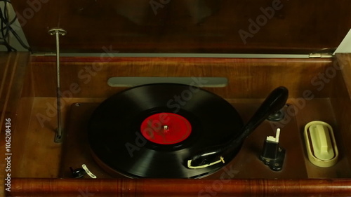 Vintage record player plays vinyl