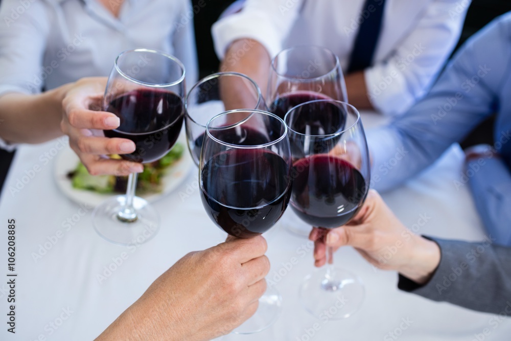 Hands toasting wine glasses Hands toasting wine glasses