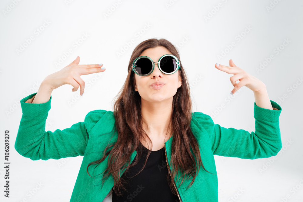 Playful pretty young woman in round sunglasses pointing on herself Playful pretty young woman in round sunglasses pointing on herself
