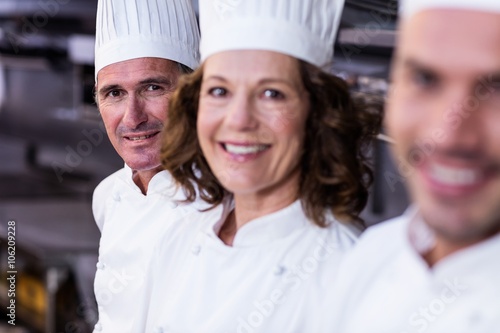 Group of happy chefs smiling at the camera 