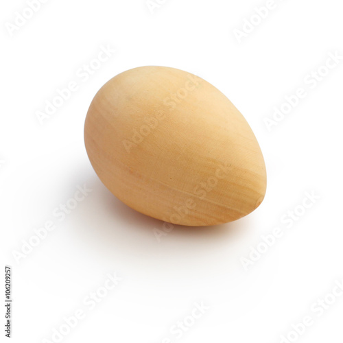 one wooden egg on a white background