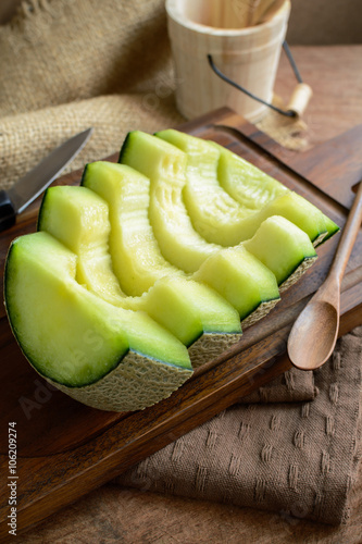 Juicy slice melon on a wooden table