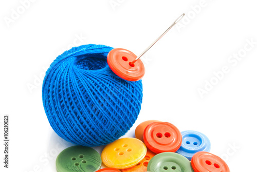 different buttons, needle and thread