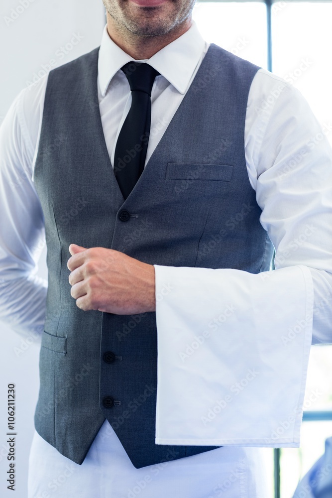 Close-up of waiter standing with napkin Close-up of waiter standing with napkin