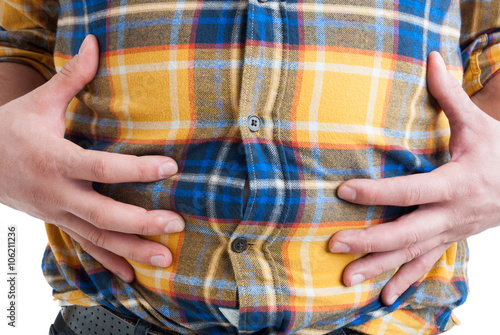 Close-up of man suffering from abdominal or stomach pain