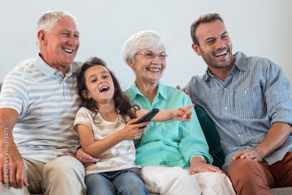 Happy family sitting on sofa Happy family sitting on sofa