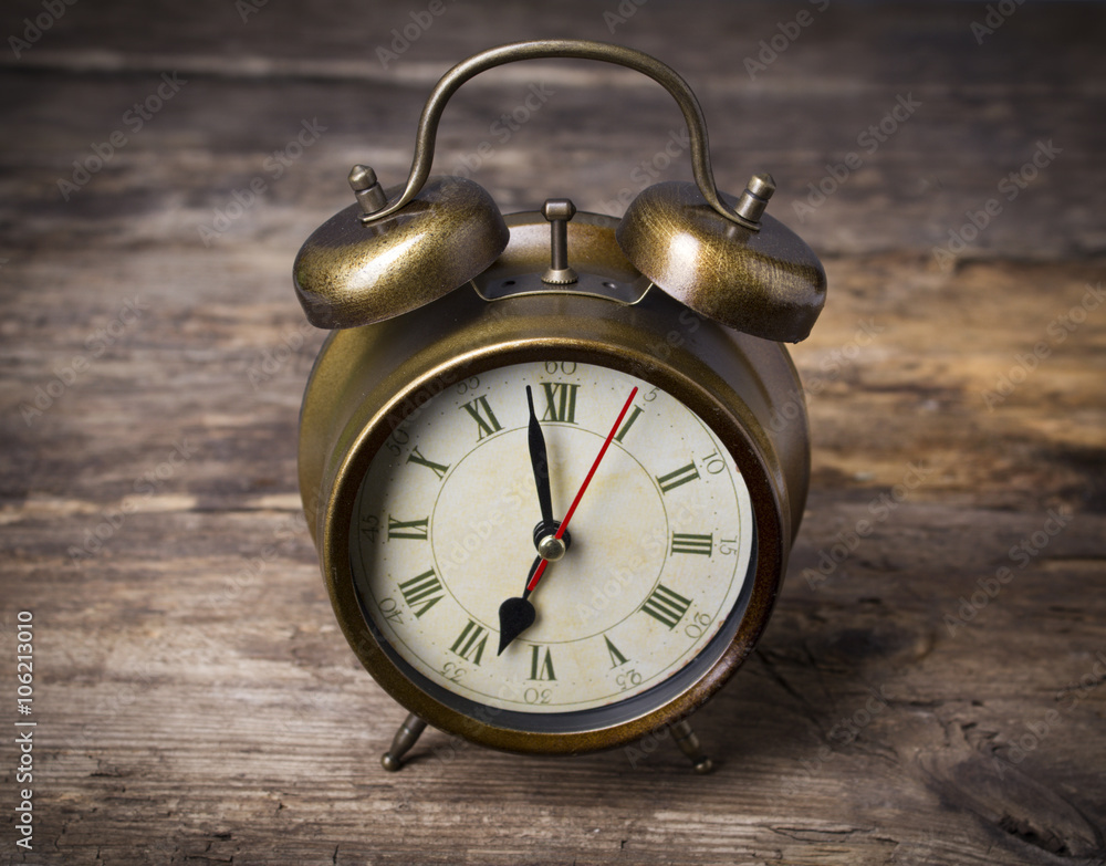 Alarm clock on wooden background Alarm clock on wooden background