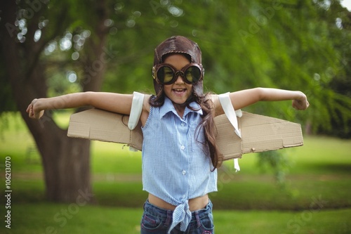 Young girl pretending to fly