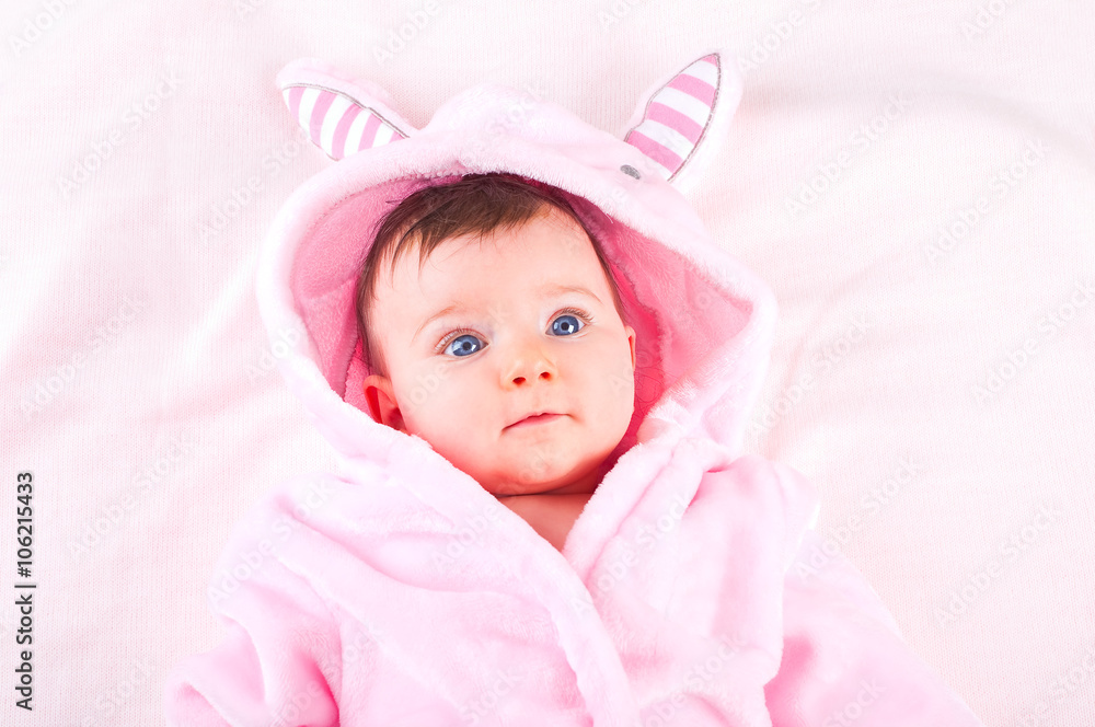 Baby girl in pink bathrobe. Baby girl in pink bathrobe.