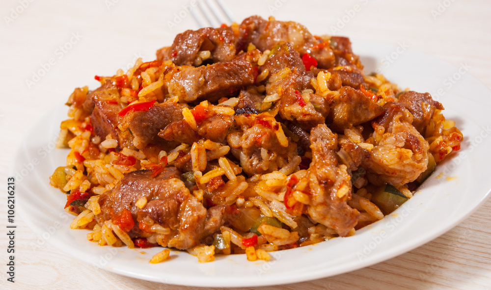 Rice with meat and vegetables on plate Rice with meat and vegetables on plate