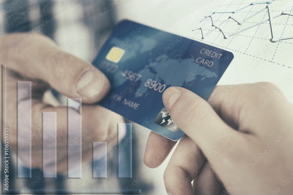 Finance concept. Hands holding a credit card Finance concept. Hands holding a credit card
