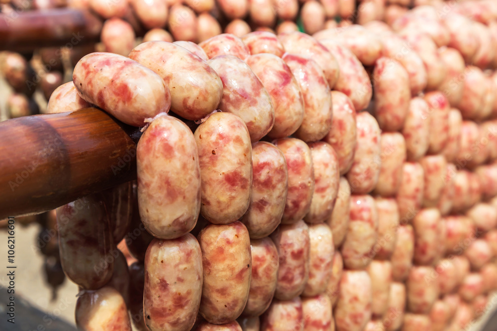 close up thai raw pork sausages hanging on the beam. close up thai raw pork sausages hanging on the beam.