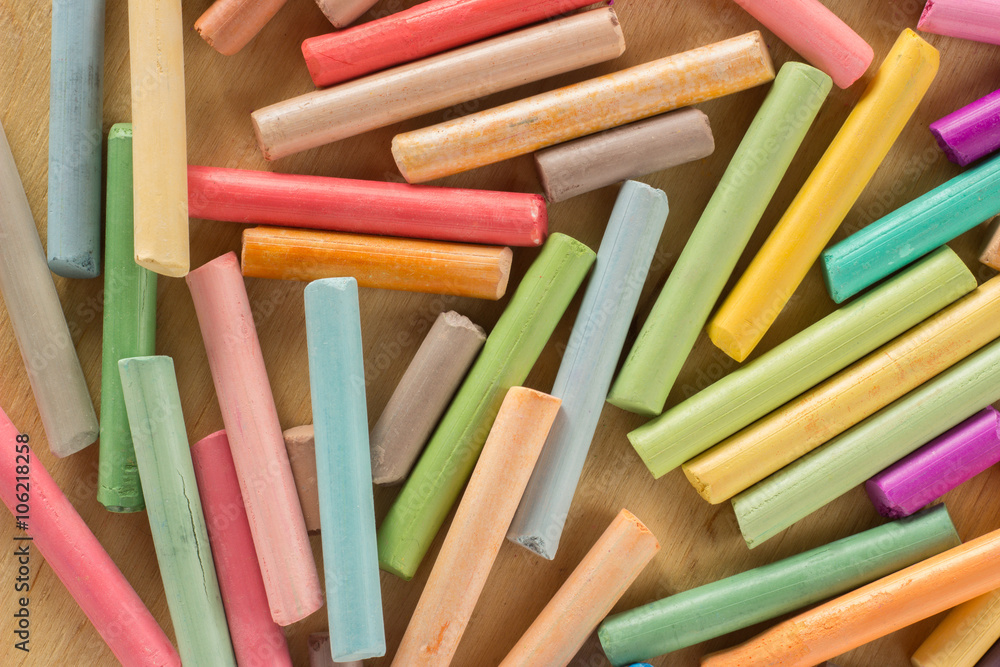 Group colored pastel chalks on a wooden background Group colored pastel chalks on a wooden background
