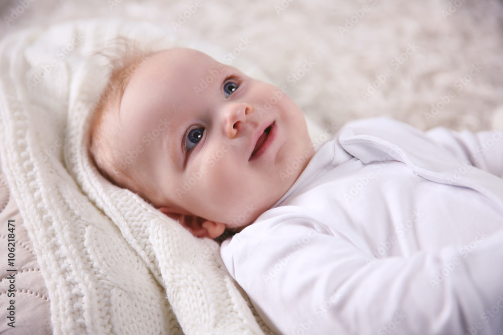 Portrait of adorable smiling baby on the floor, close up Portrait of adorable smiling baby on the floor, close up