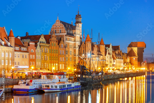 Tourist ships, Mariacka Gate and Zuraw in old town of Gdansk, Dlugie Pobrzeze and Motlawa River at night, Poland