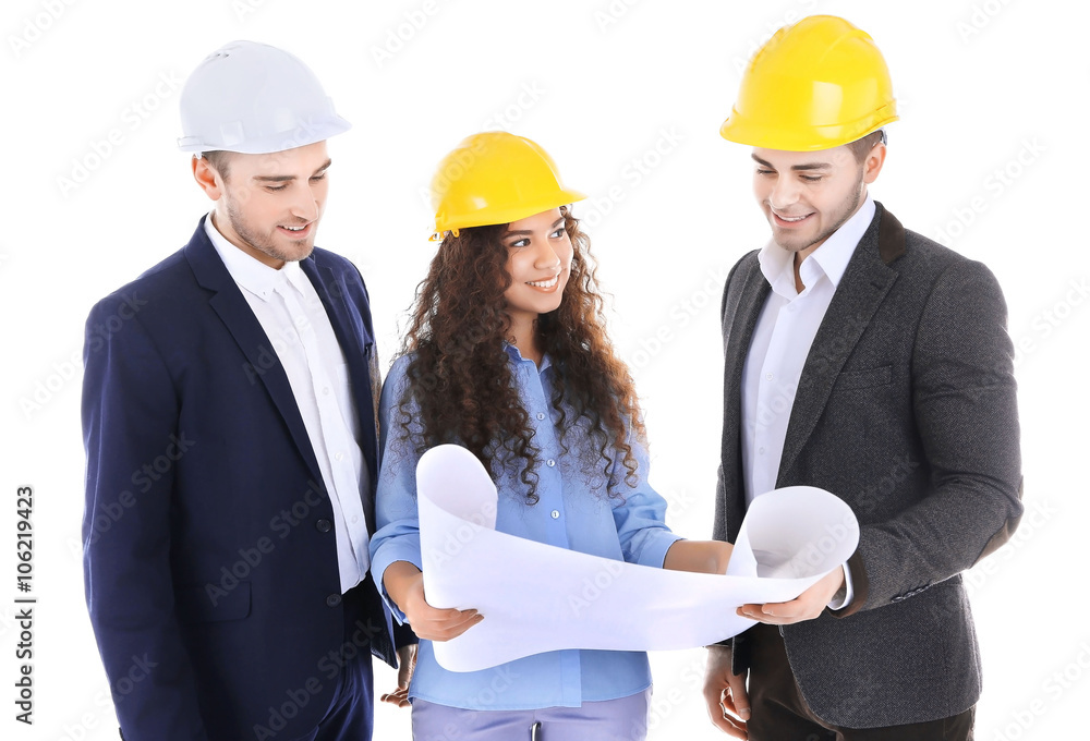 Few engineers with blueprint, isolated on white Few engineers with blueprint, isolated on white