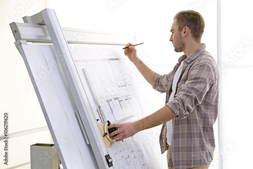 Male architects working on ...