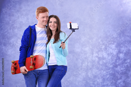 Teenager couple with skateb...