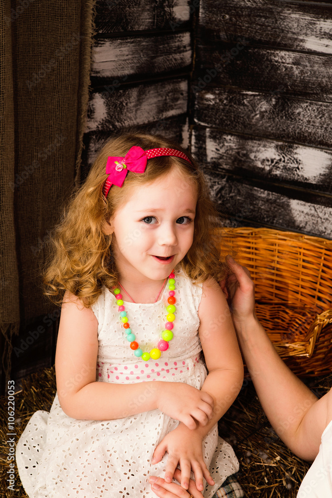 happy little girl in studio. Village decoration happy little girl in studio. Village decoration