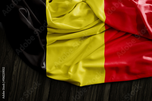 Fototapeta Naklejka Na Ścianę i Meble -  Belgian flag on wooden table