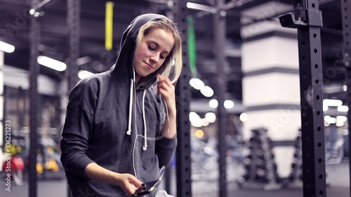 Girl have a rest after training with music