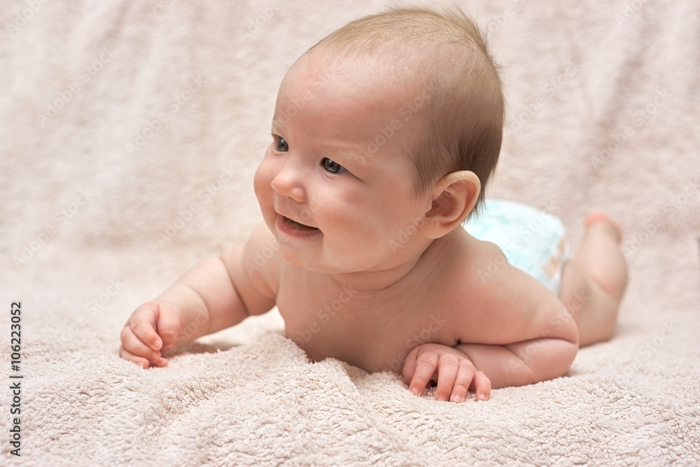 Happy baby lying on his stomach Happy baby lying on his stomach
