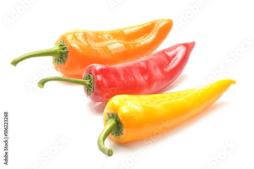 Three peppers on white background © remus20