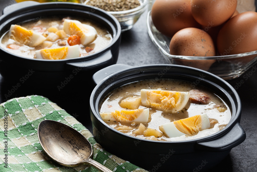 The sour soup made of rye flour with eggs The sour soup made of rye flour with eggs