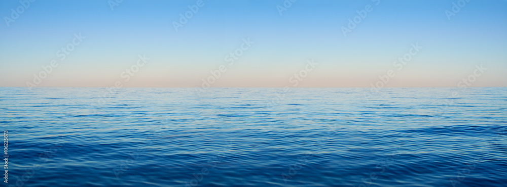 Panorama of sea waves on the background of dawn