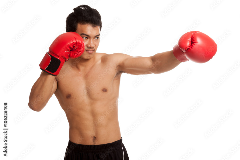 Muscular Asian man with red boxing glove