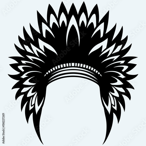 Native american indian headdress. Isolated on blue background. Vector silhouettes