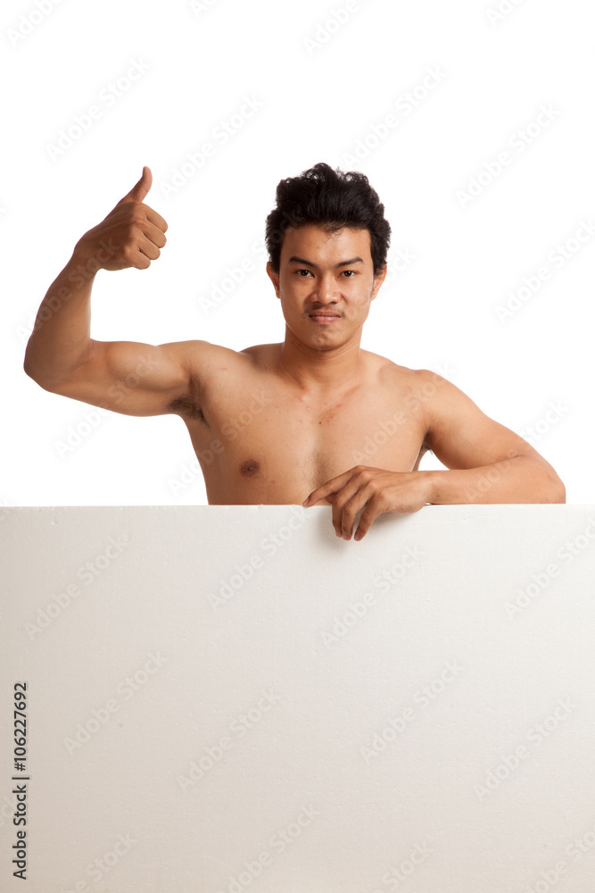 Muscular Asian man thumbs up behind blank sign Muscular Asian man thumbs up behind blank sign